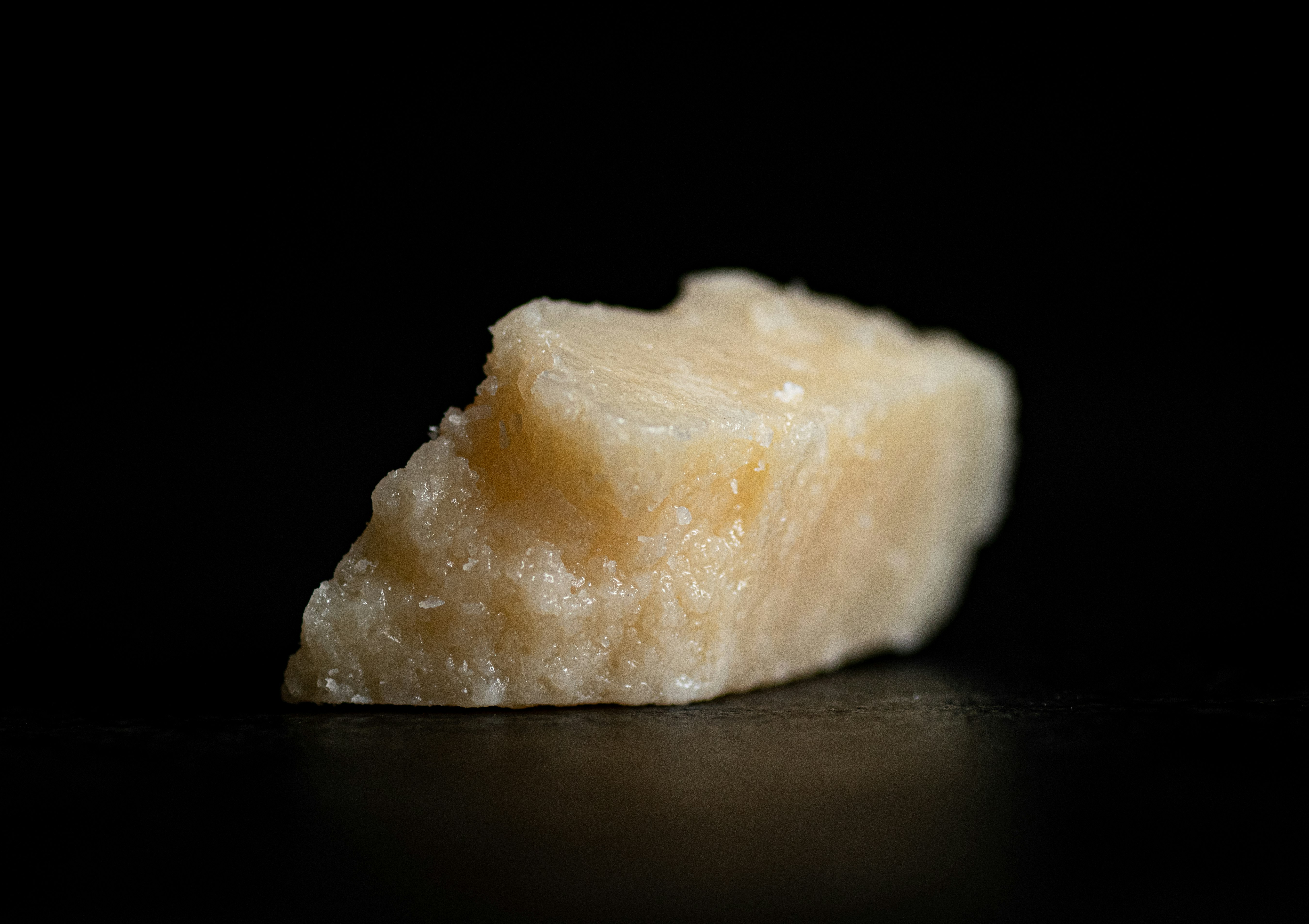 white cheese on black table
